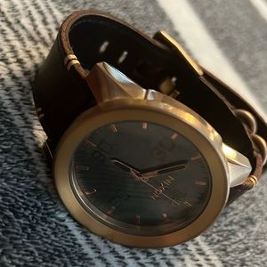 Men’s Nixon gold/leather watch